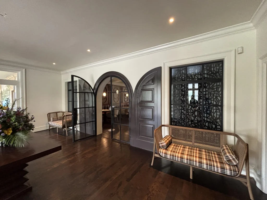 a room with a couch and two doors