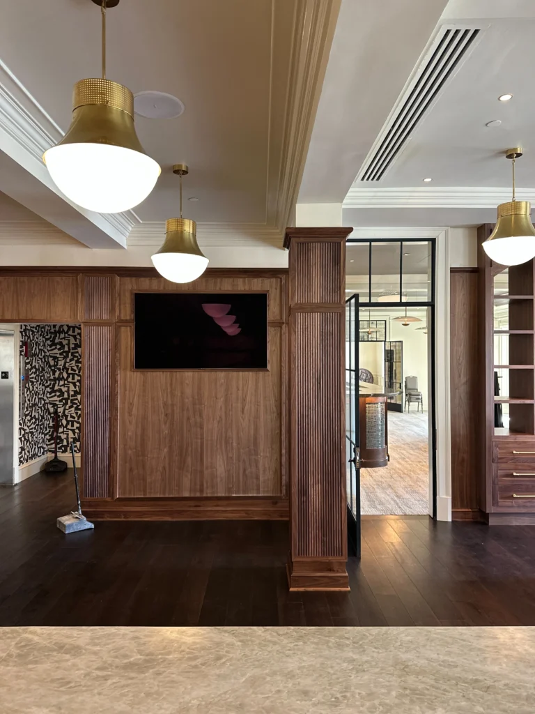 a room with wood floors and a television