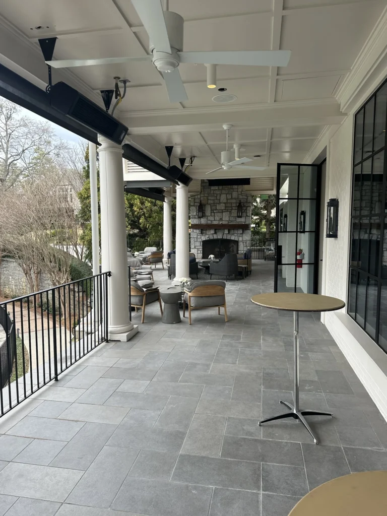 a patio with a table and chairs