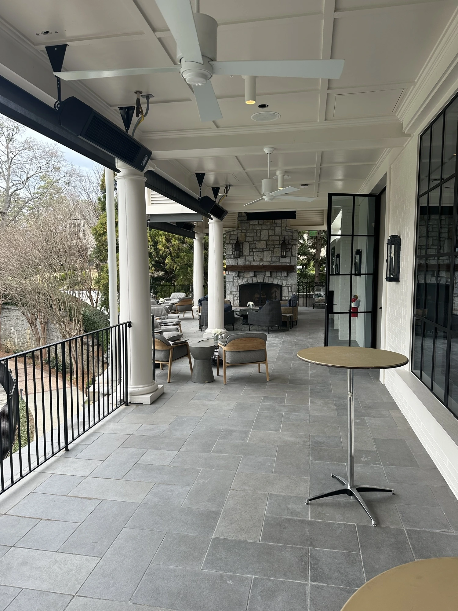 a patio with a table and chairs