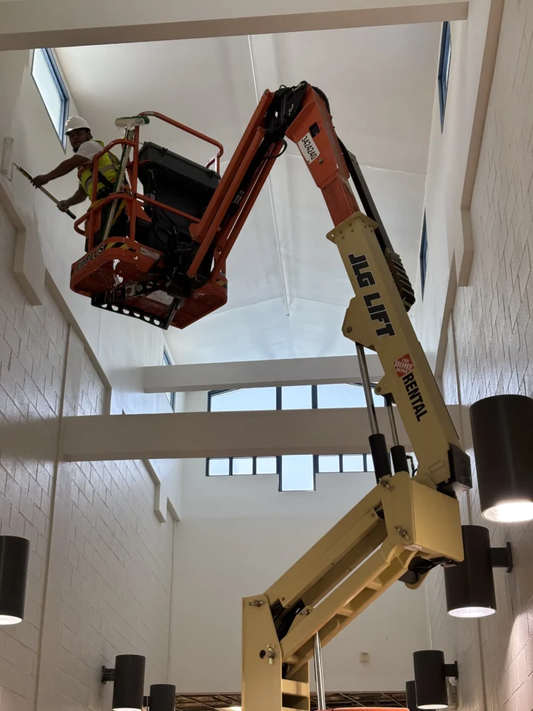 a man on a lift in a building