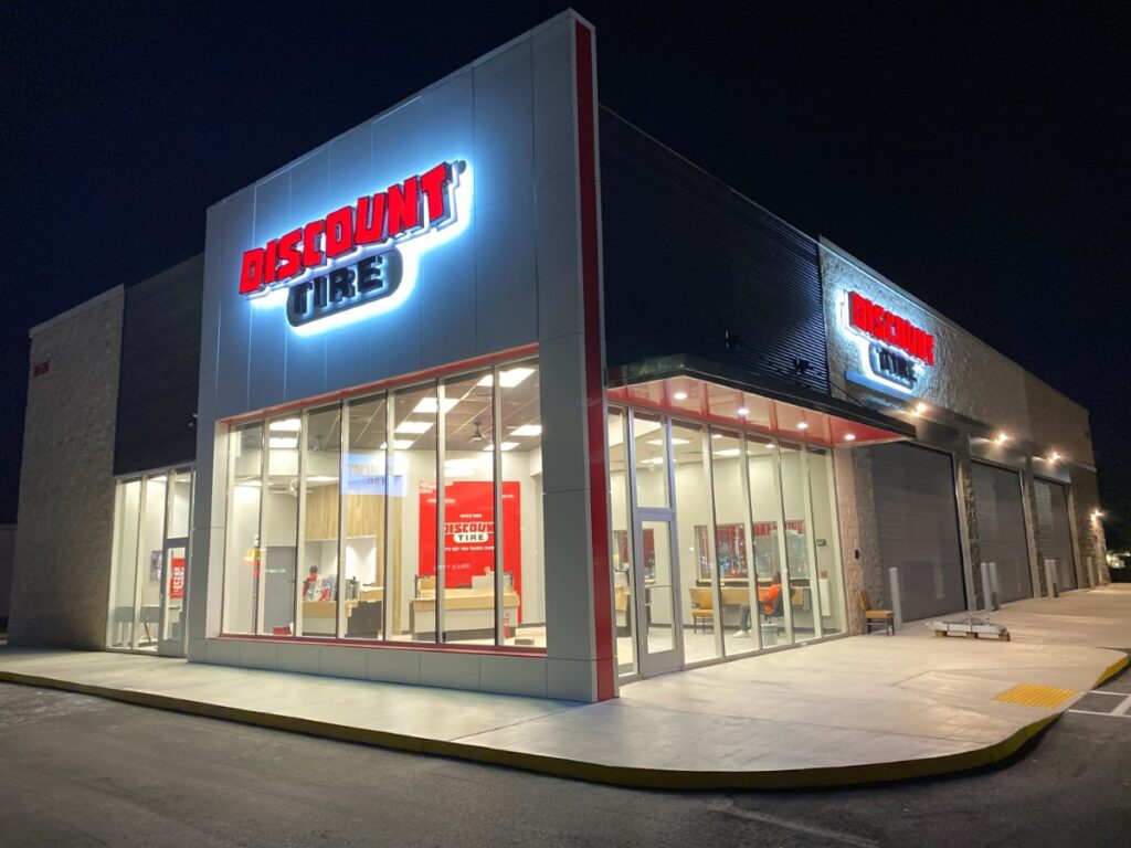 a store front with neon lights