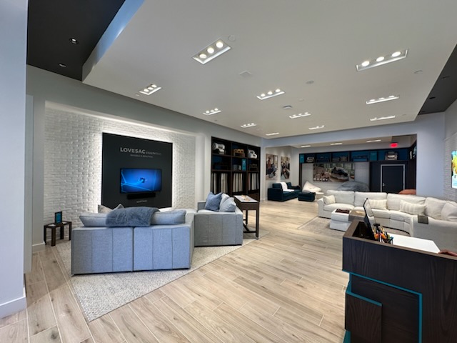 a room with couches and a tv