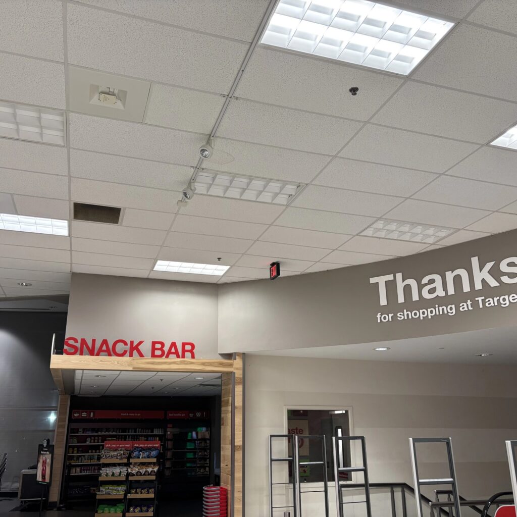 a store with a sign and a bar
