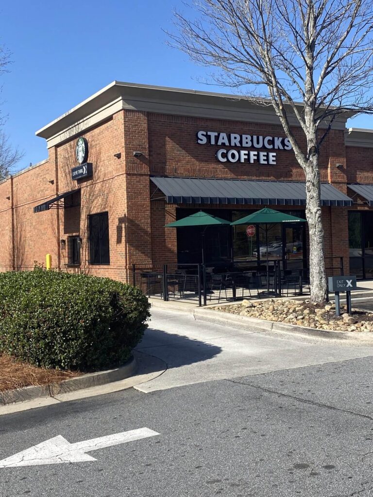 a brick building with a sign on the front
